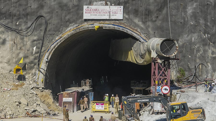 <div class="paragraphs"><p>Security personnel and others at the under-construction Silkyara tunnel as drilling through the rubble to prepare an escape route for the 41 trapped workers remains stalled, in Uttarkashi district.</p></div>
