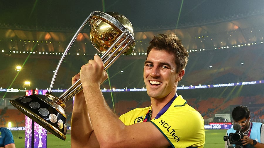 <div class="paragraphs"><p>Australia's Pat Cummins celebrates with the trophy after winning the ICC Cricket World Cup. </p></div>