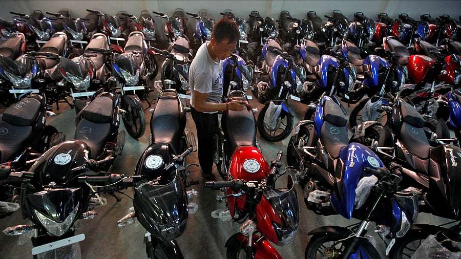 <div class="paragraphs"><p>Motorcycle sales were down in the first half of the current financial year. In pic, a worker cleans a motorcycle at a showroom in Kolkata. </p></div>