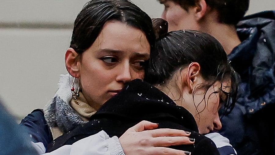 <div class="paragraphs"><p>People react at a memorial during a vigil to honour victims following a shooting at one of Charles University's buildings in Prague, Czech Republic, December 22, 2023. </p></div>