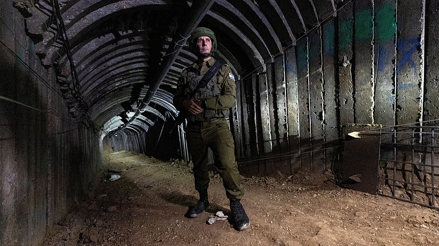 <div class="paragraphs"><p>Israeli military spokesperson Rear Admiral Daniel Hagari stands in what Israel's military says is an iron-girded tunnel designed by Hamas to disgorge carloads of Palestinian fighters for a surprise storming of the border, amid the Israeli army's ongoing ground operation against Palestinian Islamist group Hamas, close to Erez crossing in the northern Gaza Strip, December 15, 2023. </p></div>