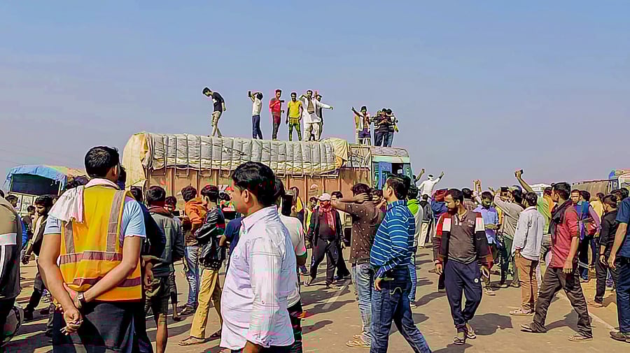 <div class="paragraphs"><p>Truck drivers block a National Highway to protest against the new penal laws for hit and run cases, at Dankuni, in Hooghly district, Sunday, Dec. 31, 2023. </p></div>