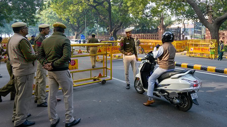 <div class="paragraphs"><p>Security personnel stops and checks vehicles near the Parliament House after a security breach on the anniversary of the 2001 Parliament terror attack on Wednesday, in New Delhi, December 14, 2023. </p></div>