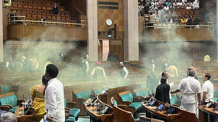 <div class="paragraphs"><p>Smoke in Parliament after intruders open cannisters in House</p></div>