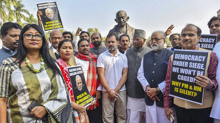 <div class="paragraphs"><p>New Delhi: Congress MPs Mallikarjun Kharge and Rahul Gandhi with suspended Opposition MPs during a protest at Mahatma Gandhi statue during the Winter session of Parliament, in New Delhi, Tuesday, Dec. 19, 2023</p></div>