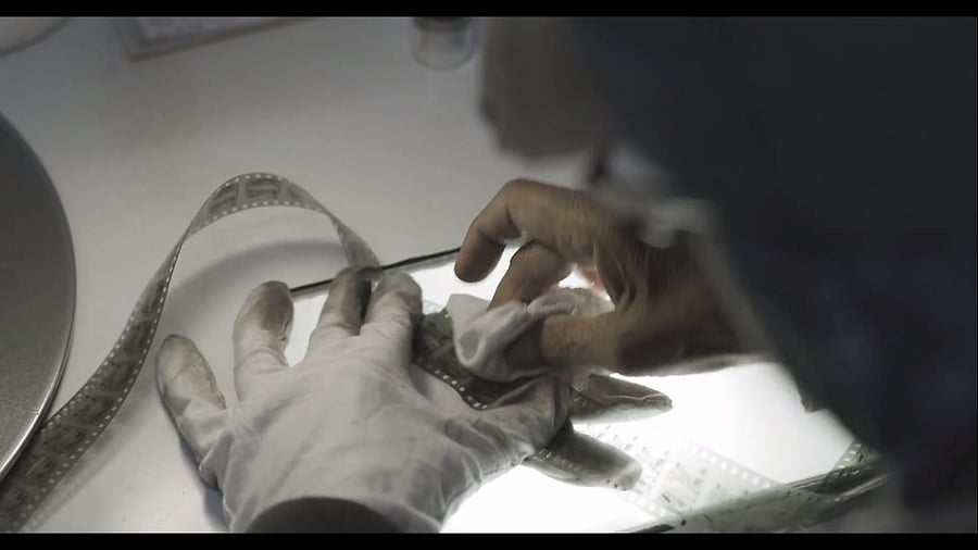 Frames are cleaned and repaired by hand before being digitised.