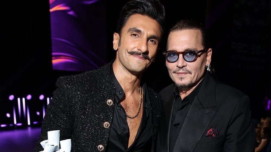 <div class="paragraphs"><p>Ranveer Singh with&nbsp;Johnny Depp.</p></div>