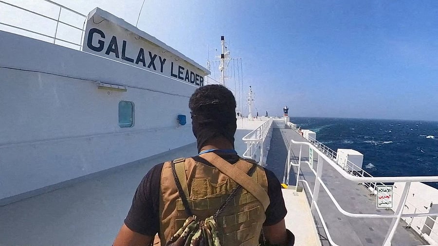 <div class="paragraphs"><p>A Houthi fighter stands on the Galaxy Leader cargo ship in the Red Sea in this photo released November 20, 2023. </p></div>