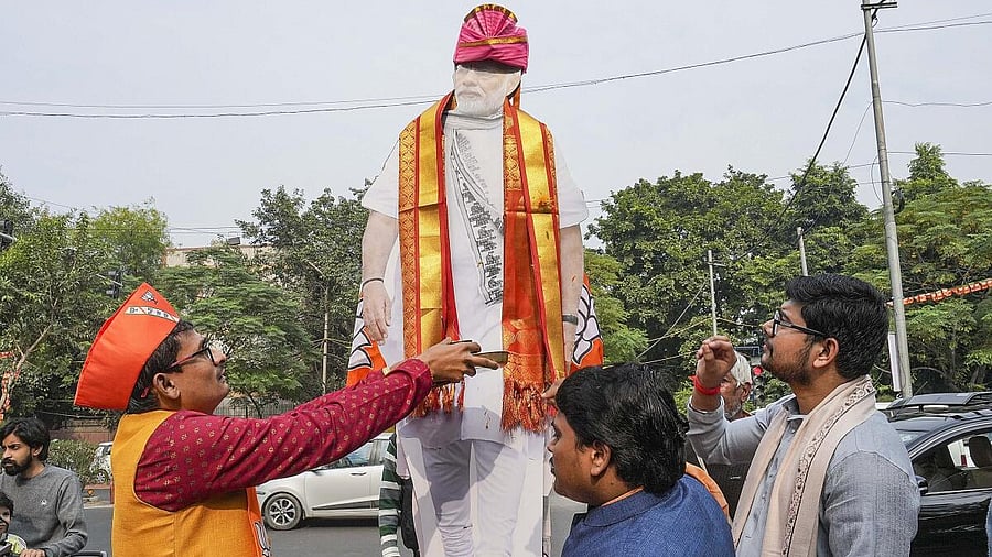 <div class="paragraphs"><p>BJP workers  celebrate as counting progresses.</p></div>