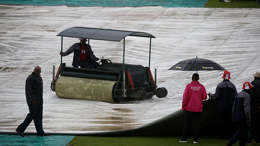 <div class="paragraphs"><p>General view as ground staff work on the field during a rain delay </p></div>