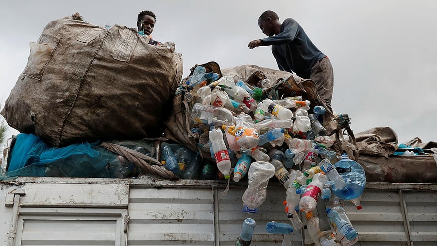 <div class="paragraphs"><p>Workers offload plastic bottles for recycling from a truck at the Dawn to Glory PET flakes export company in industrial area of Nairobi, Kenya. </p></div>