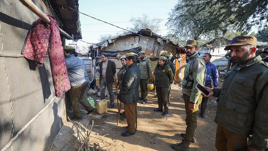 <div class="paragraphs"><p>Police personnel during a search at a Rohingya camp, in Jammu.</p></div>