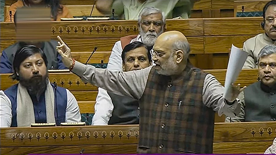 <div class="paragraphs"><p>Union Home Minister Amit Shah speaks in the Lok Sabha during the Winter session of Parliament, in New Delhi, Wednesday.</p></div>