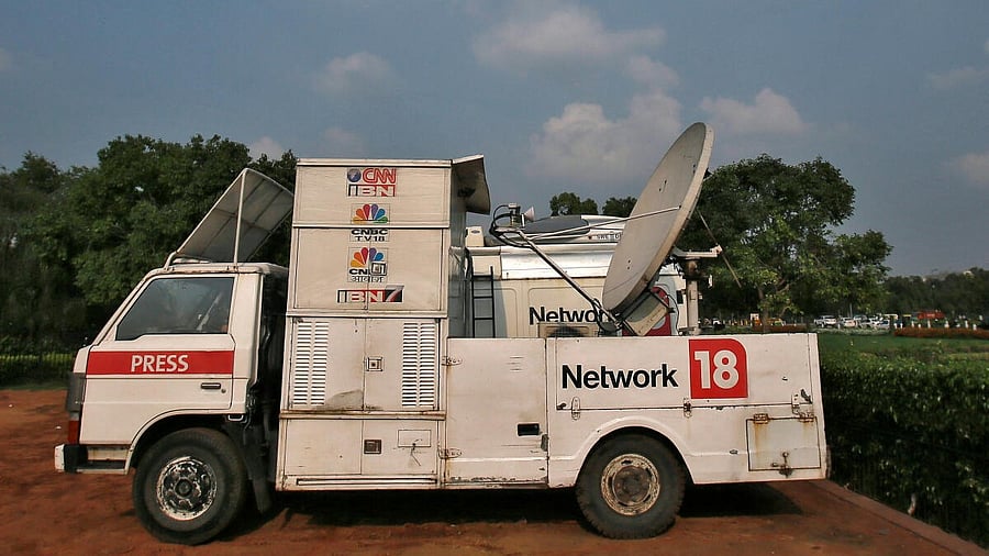<div class="paragraphs"><p>A van of media group Network18</p></div>