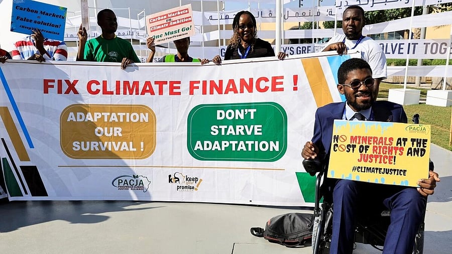<div class="paragraphs"><p>Activists hold placards and shout slogans during a protest, at the United Nations Climate Change Conference COP28 in Dubai.&nbsp;</p></div>