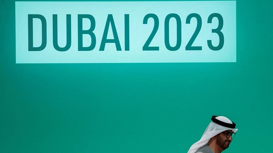 <div class="paragraphs"><p>United Arab Emirates Minister of Industry and Advanced Technology and COP28 President Sultan Ahmed Al Jaber walks at a plenary meeting, after a draft of a negotiation deal was released, at the United Nations Climate Change Conference COP28 in Dubai, United Arab Emirates.</p></div>