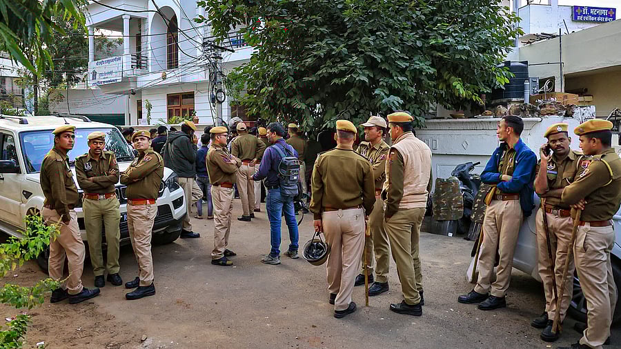 <div class="paragraphs"><p>Police personnel and FSL team members outside the residence of Shri Rashtriya Rajput Karni Sena's President Sukhdev Singh Gogamedi, where he was shot dead by unidentified assailants, in Jaipur, Tuesday, Dec. 5, 2023.</p></div>