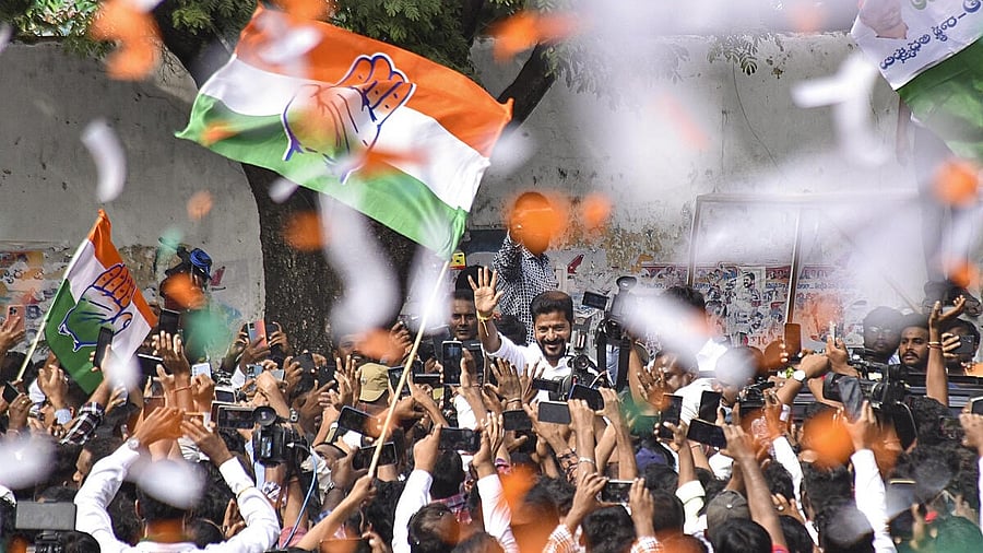 <div class="paragraphs"><p>Congress Telangana President A Revanth Reddy greets party workers and supporters celebrating the party's lead during counting of votes for Telangana Assembly elections, in Hyderabad.</p></div>