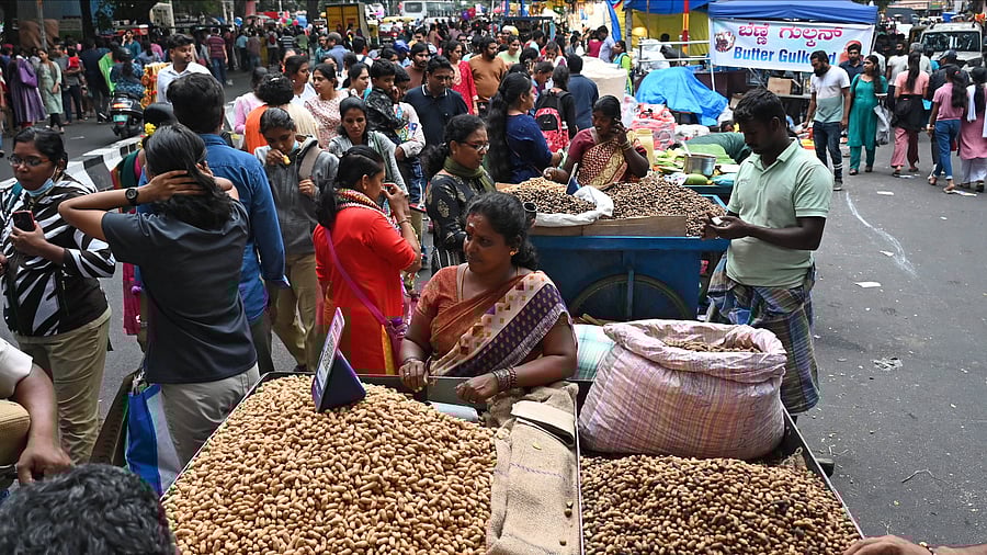 <div class="paragraphs"><p>Hundreds of people gather for the annual Kadlekai Parishe, a four-day festival celebrating the humble groundnut on Bull Temple Road in Basavanagudi on Saturday. </p></div>