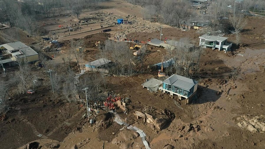 <div class="paragraphs"><p>An aerial view shows buildings covered in silt amid rescue operations after the earthquake in Gansu's Jishishan county triggered a mudslide in Jintian village, Qinghai province.</p></div>