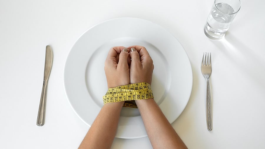 <div class="paragraphs"><p>Representative image of a person controlling their eating habits.</p></div>