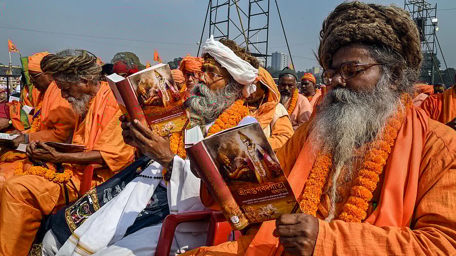 <div class="paragraphs"><p>Kolkata: BJP supporters and devotees participate in 'Lokkho Kanthe Gita Path' (one lakh Bhagwad Gita recitation) event, at Brigade Parade Ground in Kolkata, Sunday.</p></div>