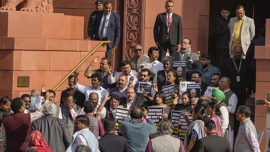 <div class="paragraphs"><p>Suspended opposition MPs protest during the Winter session of Parliament, in New Delhi.</p></div>