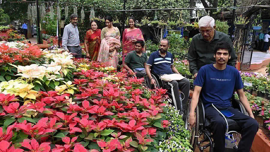<div class="paragraphs"><p>(From left) Ganesh Hegde, Director Environment Horticulture APD, Sundari Ishwar, Senior Supporter APD, Rajalakshmi Agarwal, Chairperson Ola Foundation, Sanjana Govindan, Board member APD, K.P. Sunil Kumar, Director Fundraising &amp; Communication APD and people with disability during the annual Garden Fair 2023, plants grown &amp; nurtured by a person with disabilities, a Exhibition cum sale, at The Association of People with Disability horticulture training centre at Jeevan Bhima Nagar in Bengaluru on Friday. </p></div>