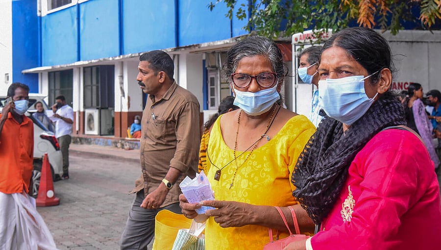 <div class="paragraphs"><p>Visitors wear masks at the Ernakulam Government Hospital after rise in number of COVID cases, in Kochi.</p></div>