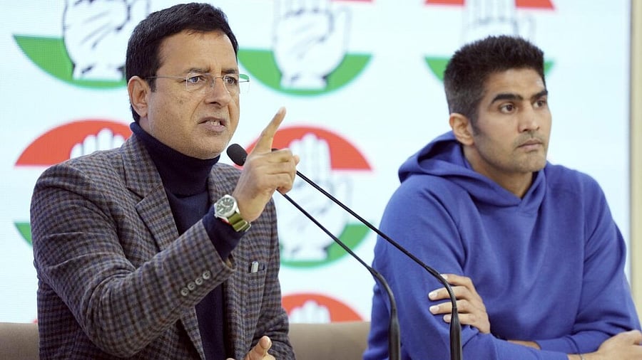 <div class="paragraphs"><p>Vijender Singh and Randeep Surjewala.</p></div>
