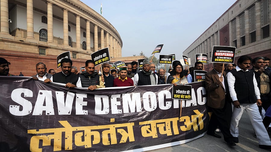 <div class="paragraphs"><p>Leader of Opposition in the Rajya Sabha Mallikarjun Kharge with suspended opposition MPs during a protest over their suspension at Mahatma Gandhi statue amid the Winter session of Parliament, in New Delhi, Thursday, Dec. 21, 2023. </p></div>