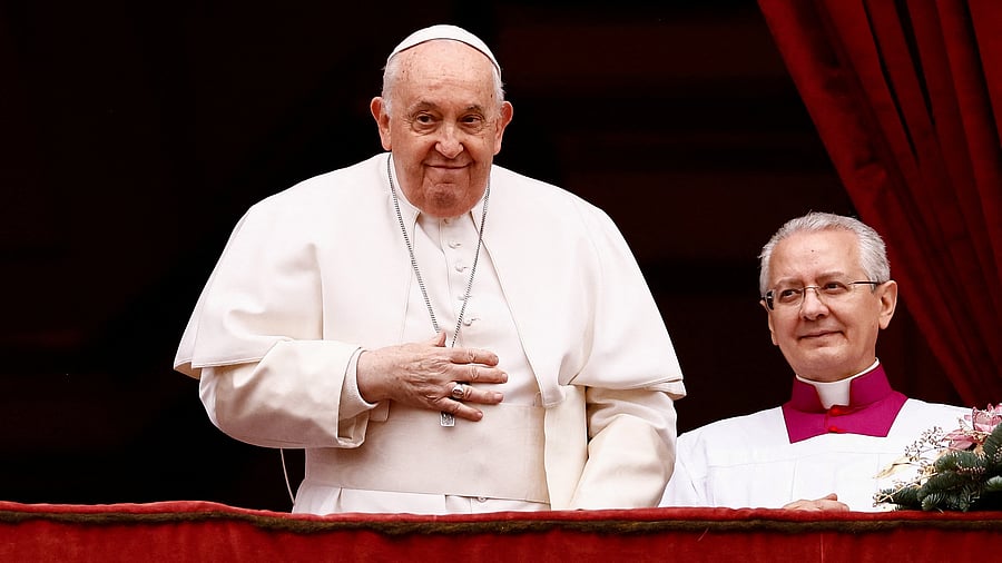 <div class="paragraphs"><p>Pope Francis looks on as he delivers his traditional Christmas Day 'Urbi et Orbi' message to the city and the world from the main balcony of St Peter's Basilica at the Vatican, December 25, 2023.</p></div>