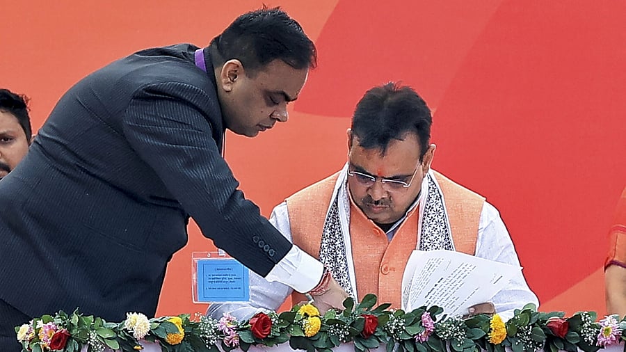 <div class="paragraphs"><p>Bhajan Lal Sharma signs after taking oath as Rajasthan's new Chief Minister. </p></div>