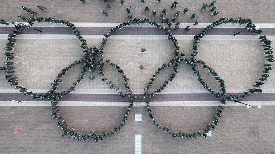 <div class="paragraphs"><p>South Korean athletes stand in the form of the Olympic rings during a military boot camp training to enhance their mental toughness for the 2024 Paris Olympics, in Pohang.</p><p></p></div>