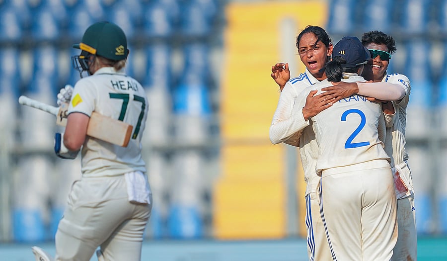 <div class="paragraphs"><p>India-Women's captain Harmanpreet Kaur celebrates with teammates after taking the wicket of Australia Womens captain Alyssa Healy on the third day of the one-off Test cricket match between India Women and Australia Women, at the Wankhede Stadium, in Mumbai, Saturday, Dec. 23, 2023. </p></div>