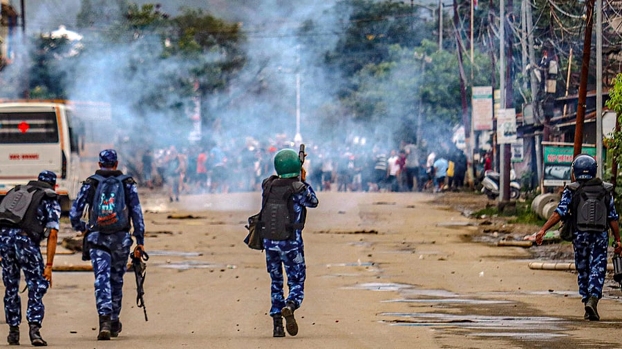 <div class="paragraphs"><p>Imphal: Security personnel fire tear gas shells as students protest against the "killing" of two missing students by unknown miscreants </p></div>