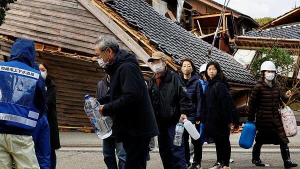 <div class="paragraphs"><p>People line up to collect water, in the aftermath of an earthquake, in Wajima.</p></div>