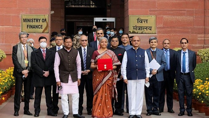 <div class="paragraphs"><p> Finance Minister Nirmala Sitharaman holds up a folder with the Government of India’s logo as she leaves her office to present the Union Budget in the parliament in New Delhi, February 1, 2022.</p></div>