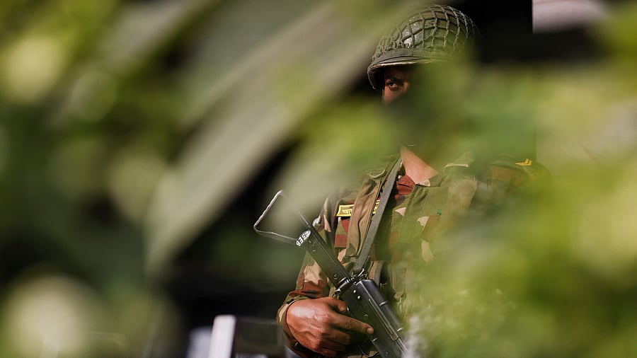 <div class="paragraphs"><p>A member of Bangladesh Army patrols in front of a temporary camp, after the army was deployed across the country, in order to help civil administration during general election in Dhaka, Bangladesh, January 3, 2024. </p></div>