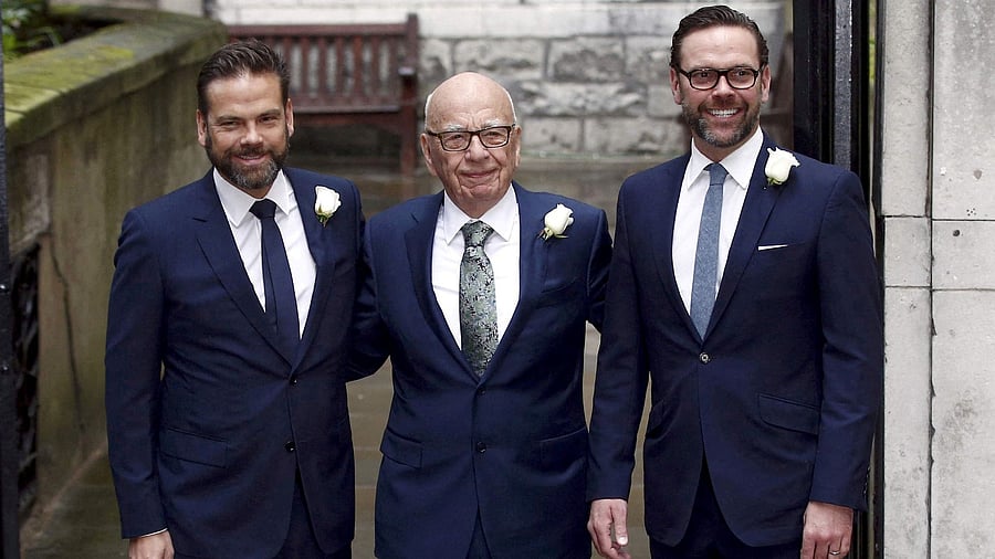 <div class="paragraphs"><p>Media mogul Rupert Murdoch poses for a photograph with his sons Lachlan and James in London.</p></div>