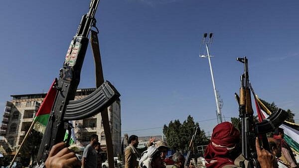 <div class="paragraphs"><p>Houthi followers hold up rifles during a parade in solidarity with the Palestinians in the Gaza Strip.</p></div>