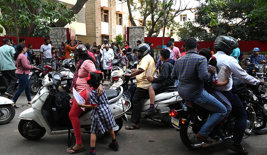 <div class="paragraphs"><p>Parents pick their children from the School by their own vehicles while private transport associations called a strike, at Malleshwara. </p></div>