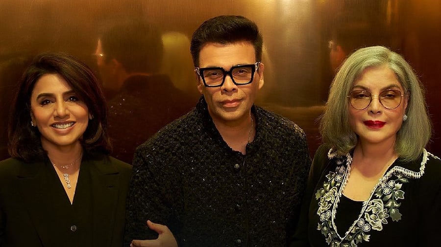 <div class="paragraphs"><p>Karan Johar flanked by Neetu Singh and Zeenat Aman.</p></div>