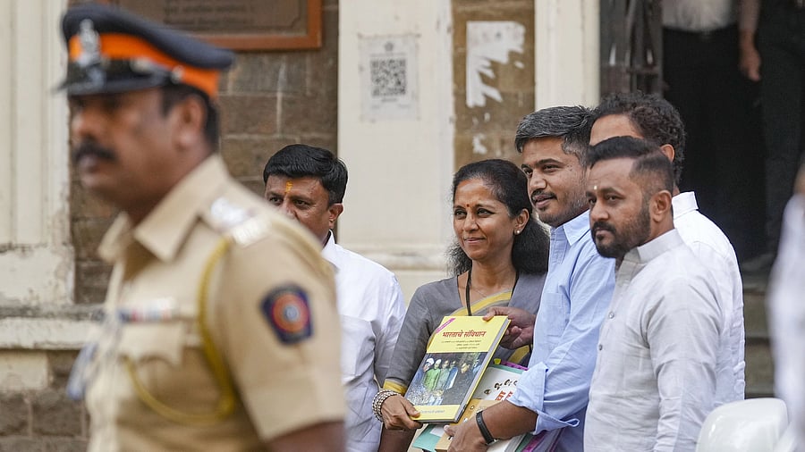 <div class="paragraphs"><p>Mumbai: NCP MLA Rohit Pawar with MP Supriya Sule arrives at the Directorate of Enforcement (ED) office for questioning in connection with its money laundering probe into the alleged Maharashtra State Cooperative Bank scam.</p></div>