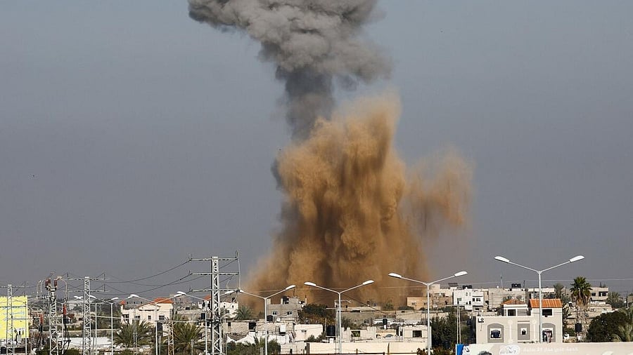 <div class="paragraphs"><p>Smoke rises following Israeli strikes, amid the ongoing conflict between Israel and the Palestinian Islamist group Hamas, as seen from Rafah, in the southern Gaza Strip.</p></div>