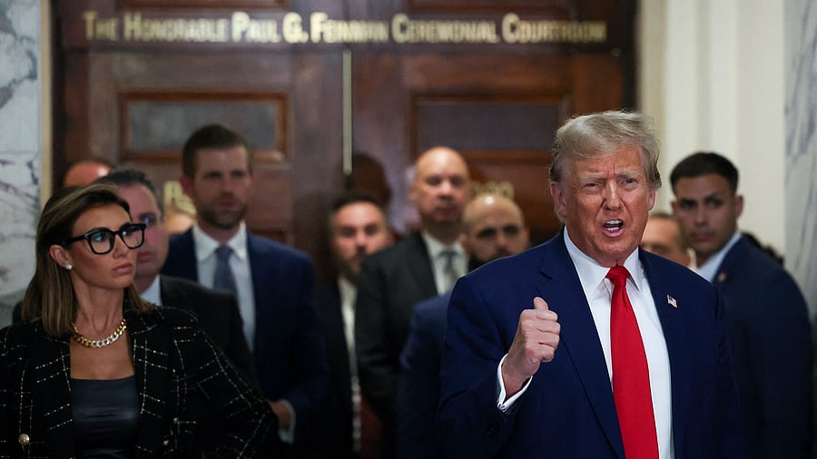 <div class="paragraphs"><p>Former US President Donald Trump, standing next to his lawyers and his son Eric Trump, speaks to the media, on the day of the closing arguments in the Trump Organization civil fraud trial at New York State Supreme Court in the Manhattan borough of New York City, US, January 11, 2024.  </p></div>