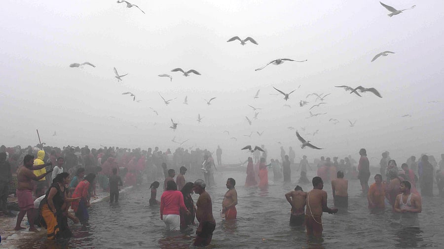 <div class="paragraphs"><p>Devotees take a holy dip in the Ganga river amid fog on a cold winter morning on the occasion of Makar Sankranti during the annual religious 'Magh Mela' festival at Sangam, in Prayagraj. </p></div>