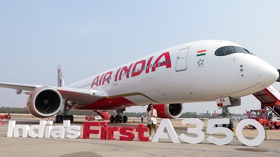 <div class="paragraphs"><p>A woman stands next to the Air India Airbus A350 aeroplane, displayed at Wings India 2024 aviation event at Begumpet airport, Hyderabad. </p></div>