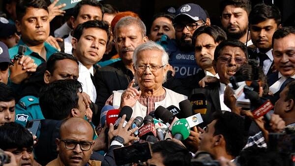 <div class="paragraphs"><p>Bangladeshi Nobel peace laureate Professor Muhammad Yunus gestures in front of the court after being sentenced for 6 months of imprisonment, in Dhaka, Bangladesh, January 1, 2024. </p></div>