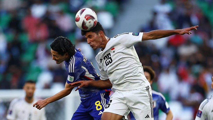 <div class="paragraphs"><p>Iraq's Ahmed Al-Hajjaj in action with Japan's Takumi Minamino</p></div>